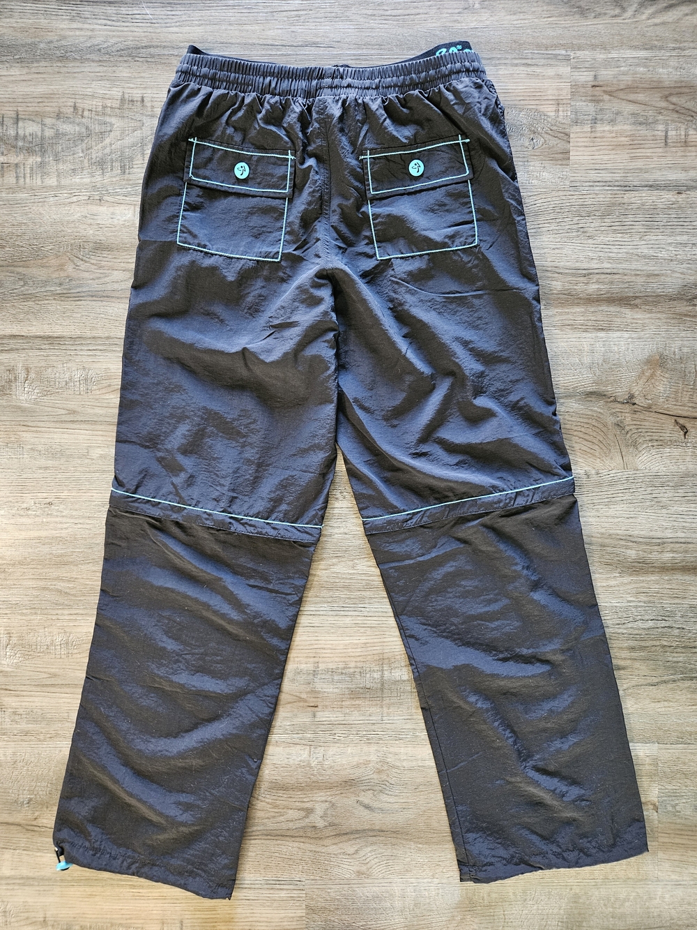 Zumba Fitness Men's Black Zip It Convertible Cargo Pants With Teal Embroidery - Picture 13 of 14